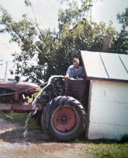 1968 Dan loading the sprayer tank.
